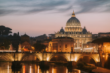 Obraz na płótnie Canvas View to bridge and Vatican City at sunset. Rome, Italy