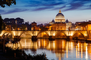 Fototapeta na wymiar View to bridge and Vatican City at sunset. Rome, Italy