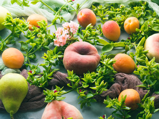 Fresh summer fruit concept still life - peaches, apricots and pears