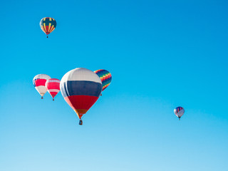 Colorful hot air balloons flying in the blue sky. The first minute after takeoff. Balloon Festival — The Golden Ring Of Russia — Pereslavl Zalesskiy.