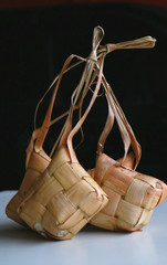 Ketupat, Traditional Rice Cakes. A type of dumpling made from rice packed inside a diamond-shaped container of woven palm leaf pouch. Served on special occasions