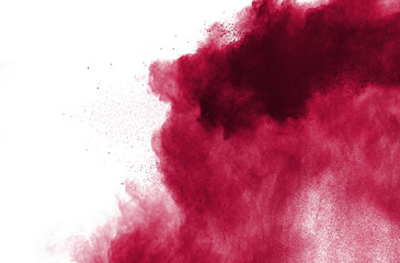 Red powder explosion on white background.