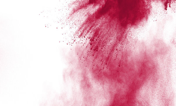 Red powder explosion on white background.