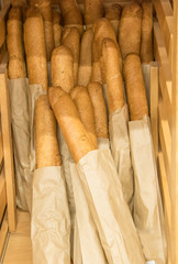 A lot of baguettes in paper packages