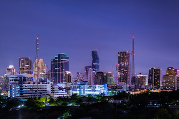 aerial view modern building business in city at dusk and night life background