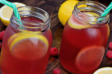 Raspberry healthy lemonade in mason jar on table