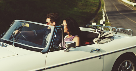 Plakat Couple Driving a Car Traveling on Road Trip Together