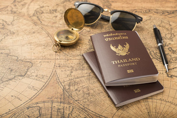 Planning travel concept, Thailand passport on old map