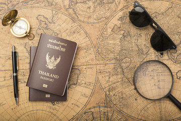 Planning travel concept, Thailand passport on old map
