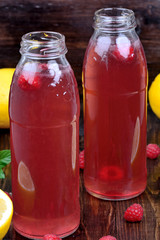 Raspberry lemonade in a bottles on table