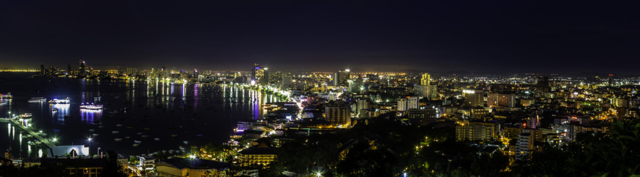 Beautiful Pattaya Bay at night./ Panorama colorful landscape gulf and city Pattaya at night on summer day in Thailand.
