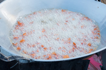 Chicken Deep Frying in hot oil pan