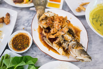 Deep Fried Sea Bass with Sauce on white dish,Thai food.