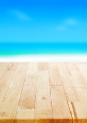 Wood table top on blurred beach background