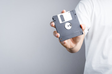 Hand holding floppy disk