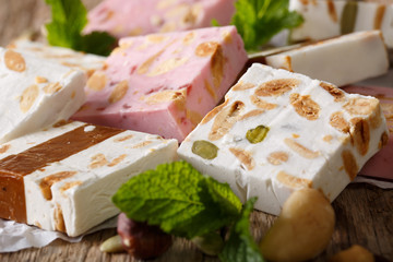 Delicious dessert: honey nougat with nuts and mint macro. horizontal