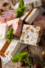 Freshly prepared honey nougat with nuts close-up. vertical