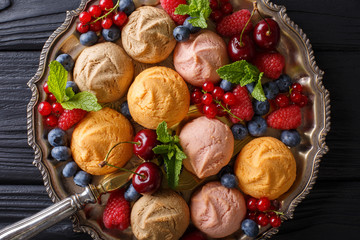 Homemade cookies with raspberries, blueberries, cherries and currants close-up. Horizontal top view 