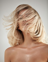 Fashion style portrait of a blonde with tangled hair