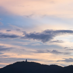 Sunset Behind Big Buddha Statue on Mountain Phuket