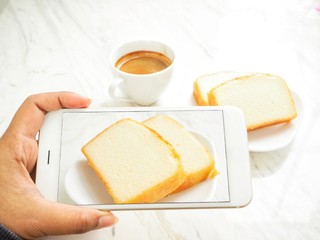 Taking a photo of butter cake with smart phone