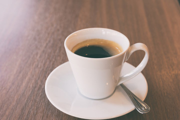  Cup of coffee on a wooden table