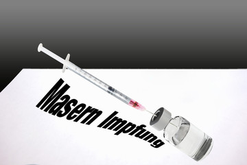 Syringe is filled with vaccine for measles vaccination.