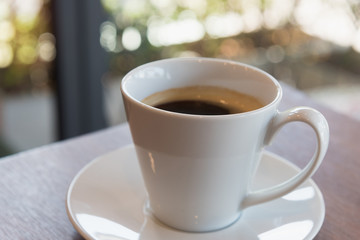  Cup of coffee on a wooden table