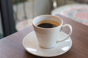  Cup of coffee on a wooden table