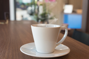  Cup of coffee on a wooden table