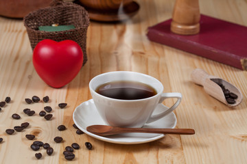 White Cup of coffee on Pine wood desktop table on top