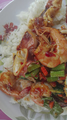 Rice with stir-fried shrimp, squid and basil. thai food