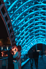 Loving couple on the bridge of Peace