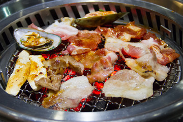 Raw food on the stove, charcoal grill