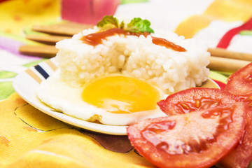 Eggs with rice and tomato