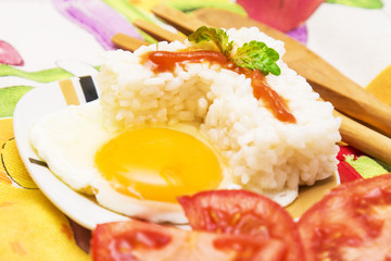 Eggs with rice and tomato