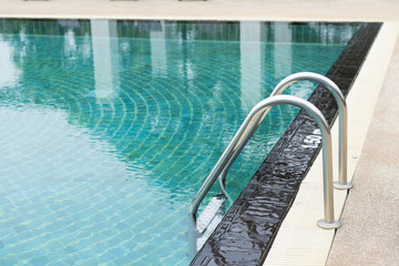 outdoor swimming pool with stair in a building