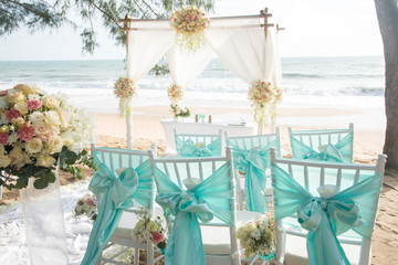 Romantic wedding ceremony on the beach under the pines.