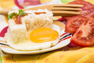 Eggs with rice and tomato