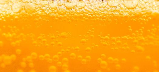 bubble beer close up / yellow background / water / drink