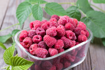 Frozen raspberries in a container
