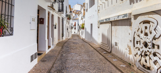 Panorama of a coblestoned street in Altea © venemama