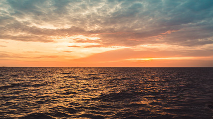 Sunset sky and cloud at the beach, sky background.