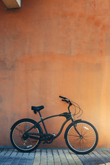 Fototapeta na wymiar City Cruiser Bicycle Bike Parked Near Wall Health Leisure Town Urban Lifestyle Vehicle