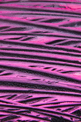 Fototapeta na wymiar Smeared pink lipstick creative background. Fuchsia strokes on black backdrop. Cosmetics commercial, beautiful style. Glamorous magazine, beauty concept