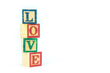 wooden toy cubes are used to create the word love,Love concept or valentine day.