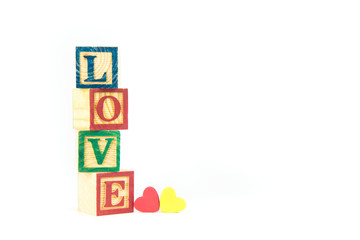 wooden toy cubes are used to create the word love,Love concept or valentine day.