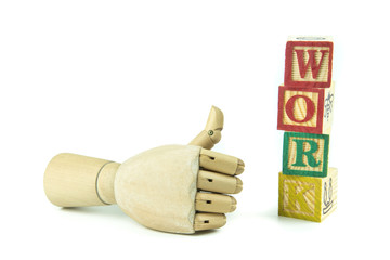 wooden toy cubes are used to create the word work.