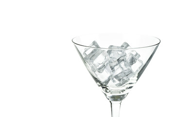 Empty Cocktail glass with ice cubes on white background