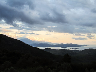 Fototapeta premium Cloudy view from the mountains in Gocek, Turkey - beach town of Fethiye below
